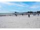 Beach volleyball game in progress on a sunny day, with players and the pier visible in the distance at 200 4Th S Ave # 303, St Petersburg, FL 33701