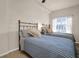 Bright bedroom with two beds, side table, lamp, and a window with view at 200 4Th S Ave # 303, St Petersburg, FL 33701
