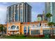 St. Petersburg Yacht Club showcasing architectural design with palms and greenery, framed by modern high-rises at 200 4Th S Ave # 303, St Petersburg, FL 33701