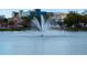 A water fountain in a lake with buildings and trees in the background at 200 4Th S Ave # 303, St Petersburg, FL 33701
