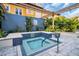 Community hot tub featuring classic blue tiles and lush plants to bring a luxury, spa-like experience to residents at 200 4Th S Ave # 303, St Petersburg, FL 33701