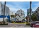 Unique circular sculpture at street level with restaurants and palm trees visible, offering an artistic view at 200 4Th S Ave # 303, St Petersburg, FL 33701