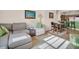 Bright and open living space featuring a modern sofa and dining area at 200 4Th S Ave # 303, St Petersburg, FL 33701
