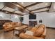 Lounge with hardwood floors, exposed beams, leather seating and a fireplace, creating a cozy and inviting community gathering space at 200 4Th S Ave # 303, St Petersburg, FL 33701
