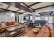 Lounge featuring hardwood floors, exposed wood beams, leather couches and dining tables, making it ideal for gatherings and relaxation at 200 4Th S Ave # 303, St Petersburg, FL 33701