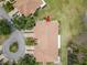 Birds eye view of home's roof including the driveway, sidewalk, and landscaped front yard at 2309 New Orchard Ct, Sun City Center, FL 33573