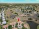 Scenic aerial view of the home with a pond and golf course nearby in a beautiful neighborhood at 2309 New Orchard Ct, Sun City Center, FL 33573
