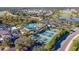 An aerial view of a community pool, pickleball courts, and golf course, showcasing the available amenities at 2309 New Orchard Ct, Sun City Center, FL 33573