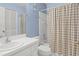 Bathroom featuring vanity with ample storage, a tub, and a shower with neutral tones at 2309 New Orchard Ct, Sun City Center, FL 33573