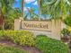A community sign that reads 'Nantucket' surrounded by lush, tropical landscaping at 2309 New Orchard Ct, Sun City Center, FL 33573