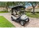 A golf cart parked on a paved driveway, ready for a relaxing ride around the community at 2309 New Orchard Ct, Sun City Center, FL 33573