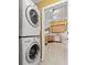 Laundry area featuring appliances with tile flooring adjacent to kitchen at 2309 New Orchard Ct, Sun City Center, FL 33573