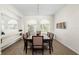 Elegant dining room with a large table, stylish decor, and plenty of natural light at 2513 Regal River Rd, Valrico, FL 33596