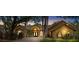 Beautiful home with a well-manicured lawn and mature trees, creating a welcoming curb appeal at 2513 Regal River Rd, Valrico, FL 33596
