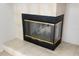 A traditional fireplace with a black frame and gold trim, offering a cozy ambiance at 2513 Regal River Rd, Valrico, FL 33596