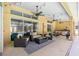 Expansive covered outdoor living area with comfortable seating and a full outdoor kitchen, perfect for entertaining at 2513 Regal River Rd, Valrico, FL 33596