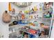 Walk-in pantry with lots of metal shelving, ideal for optimal organization and storage at 2513 Regal River Rd, Valrico, FL 33596