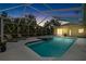 Inviting screened-in pool and hot tub area, perfect for relaxation and entertainment under the open sky at 2513 Regal River Rd, Valrico, FL 33596