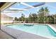 Enclosed pool and spa with an outdoor living space perfect for relaxation and entertainment at 2513 Regal River Rd, Valrico, FL 33596