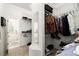 A spacious walk-in closet with shelving and rods, providing ample storage space at 2513 Regal River Rd, Valrico, FL 33596
