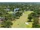 Aerial view of golf course and community highlighting green fairways, water hazards and scenic residential area at 2525 Madrid S Way, St Petersburg, FL 33712
