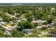 An aerial view of a neighborhood with mature trees and homes in a residential area near the water at 2525 Madrid S Way, St Petersburg, FL 33712