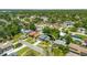 An aerial shot of a beautiful home featuring lush landscaping, a well-manicured lawn, and a welcoming entrance at 2525 Madrid S Way, St Petersburg, FL 33712