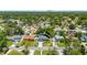 An aerial shot capturing the property's suburban feel and treed yard and street at 2525 Madrid S Way, St Petersburg, FL 33712