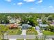 Charming single-Gathering home with a well-manicured lawn and lush landscaping in a quiet, tree-lined neighborhood at 2525 Madrid S Way, St Petersburg, FL 33712