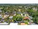 An aerial shot capturing the property's treed backyard, and suburban feel with city views at 2525 Madrid S Way, St Petersburg, FL 33712