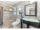 Stylish bathroom featuring a glass shower and vanity with a glass top at 2525 Madrid S Way, St Petersburg, FL 33712