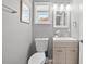 Charming bathroom features a modern vanity, toilet, and neutral decor at 2525 Madrid S Way, St Petersburg, FL 33712