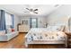 Relaxing bedroom featuring a queen bed and wood flooring at 2525 Madrid S Way, St Petersburg, FL 33712