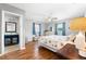 This bedroom is open and bright with hardwood floors, neutral grey walls, and direct access to the bathroom at 2525 Madrid S Way, St Petersburg, FL 33712