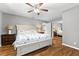 Cozy bedroom with a queen bed, and mirrored closet doors at 2525 Madrid S Way, St Petersburg, FL 33712