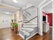 Inviting entryway and staircase featuring wood floors and natural light at 2525 Madrid S Way, St Petersburg, FL 33712