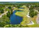 Picturesque aerial shot of golf course with serene lakes, manicured greens, and natural surroundings at 2525 Madrid S Way, St Petersburg, FL 33712