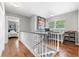 Upstairs landing with an office space that features a desk and chair at 2525 Madrid S Way, St Petersburg, FL 33712