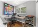 Comfortable office space with a large desk, rolling chair and natural lighting at 2525 Madrid S Way, St Petersburg, FL 33712