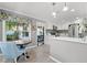 Bright eat-in kitchen with white cabinets, stainless steel appliances, breakfast nook with backyard view at 2525 Madrid S Way, St Petersburg, FL 33712
