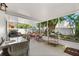 This enclosed outdoor patio features ample seating and dining space, perfect for entertaining or relaxing at 2525 Madrid S Way, St Petersburg, FL 33712