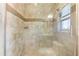 Modern glass shower with tile walls and a built-in shelf at 2525 Madrid S Way, St Petersburg, FL 33712