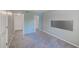 This room is carpeted, has an empty closet and a large decorative metallic panel at 2690 Coral Landings Blvd # 122, Palm Harbor, FL 34684