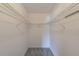 Empty closet with wire shelving and carpeted floor at 2690 Coral Landings Blvd # 122, Palm Harbor, FL 34684