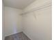 Empty closet with wire shelving and carpeted floor at 2690 Coral Landings Blvd # 122, Palm Harbor, FL 34684