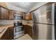 This kitchen features stainless steel appliances, tiled backsplash, and sleek countertops at 2690 Coral Landings Blvd # 122, Palm Harbor, FL 34684