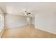 Bright and spacious living room with tile flooring, ceiling fans, and neutral paint at 2690 Coral Landings Blvd # 122, Palm Harbor, FL 34684