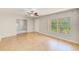 Living room featuring tile floors, natural light, a ceiling fan, and neutral paint at 2690 Coral Landings Blvd # 122, Palm Harbor, FL 34684