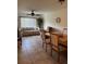 Bright living room featuring comfortable seating, ceiling fan, and tile flooring at 2961 Flint N Dr, Clearwater, FL 33759