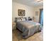 Cozy bedroom with tile floors, a queen bed, and natural lighting, providing a serene retreat at 2961 Flint N Dr, Clearwater, FL 33759